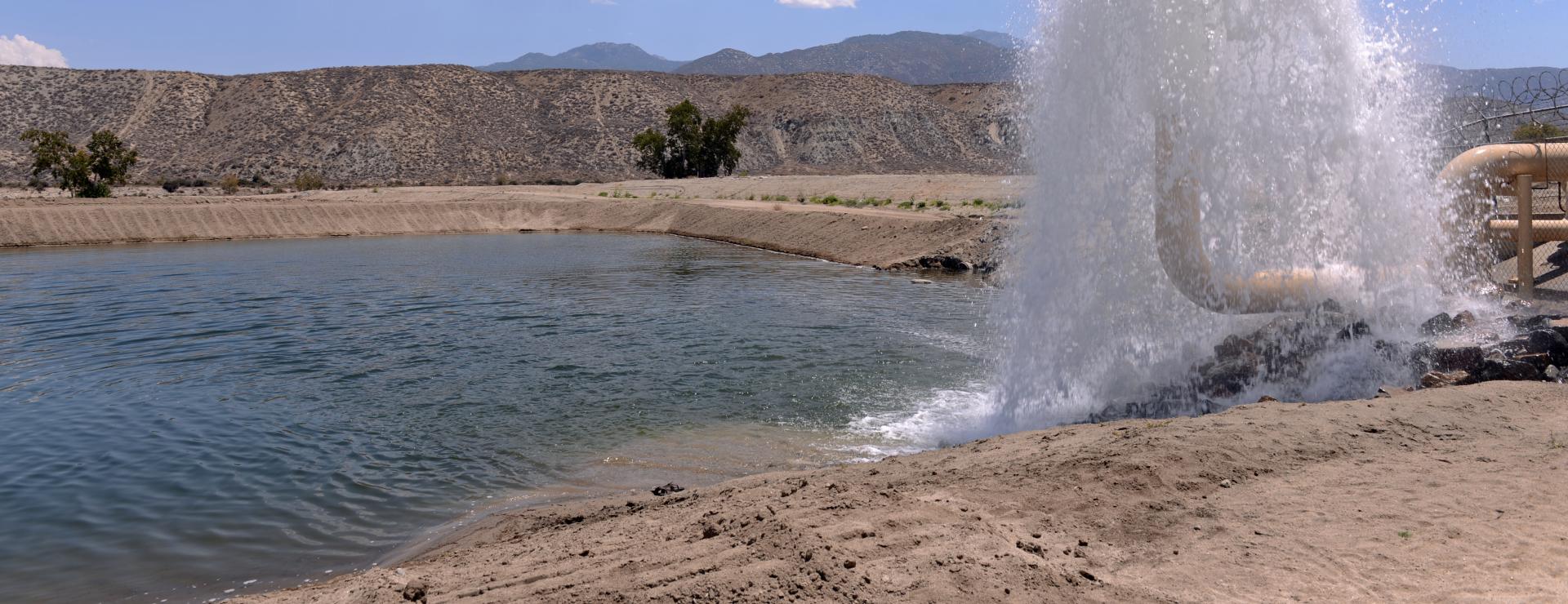 Water spout at groundwater supply pond.