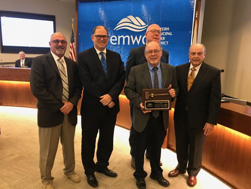 Ronald Sullivan holds EMWD board of directors president plaque. 