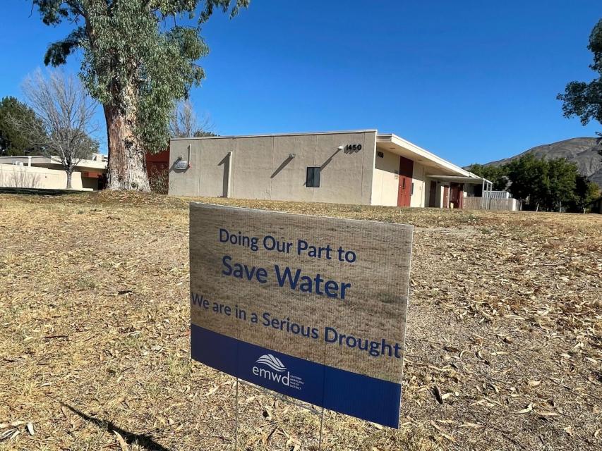 A sign that says: Doing Our Part to Save Water. We are in a serious drought..