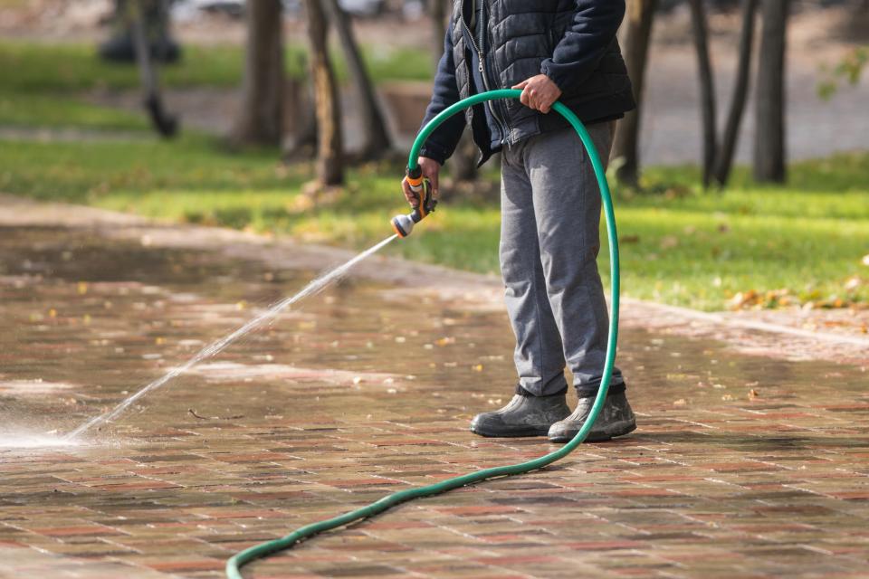 Using a hose to spray water