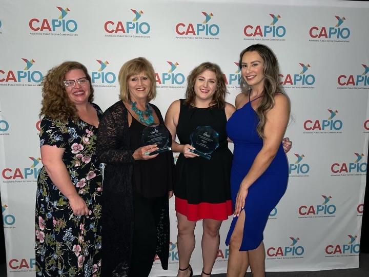 Four CAPIO Award Winners standing side by side